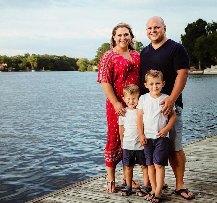A photo of Ben Decker, his wife and two children